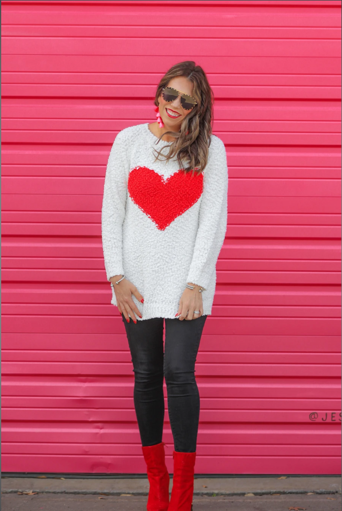 long sleeve crew neck sweater with an oversized contrasting red heart on popcorn fabric