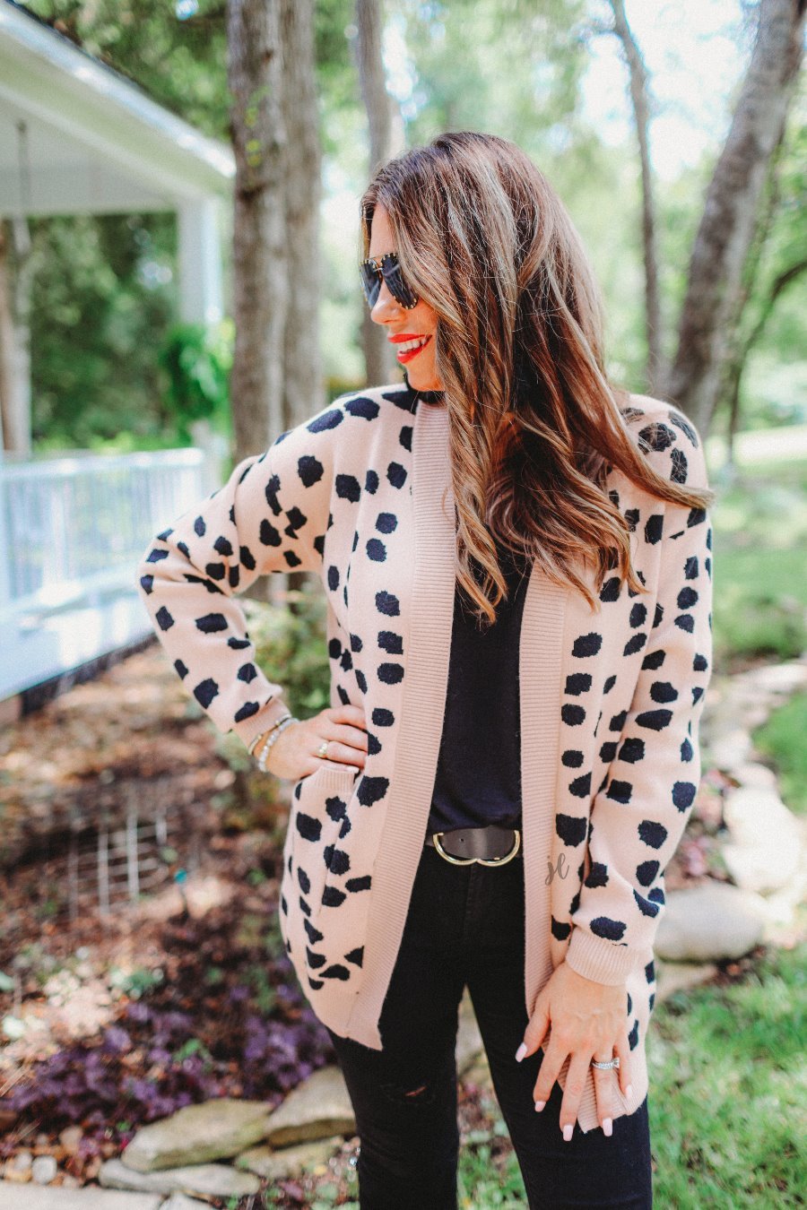 long-sleeve open front cardigan, finished in a black animal print on a neutral blush base