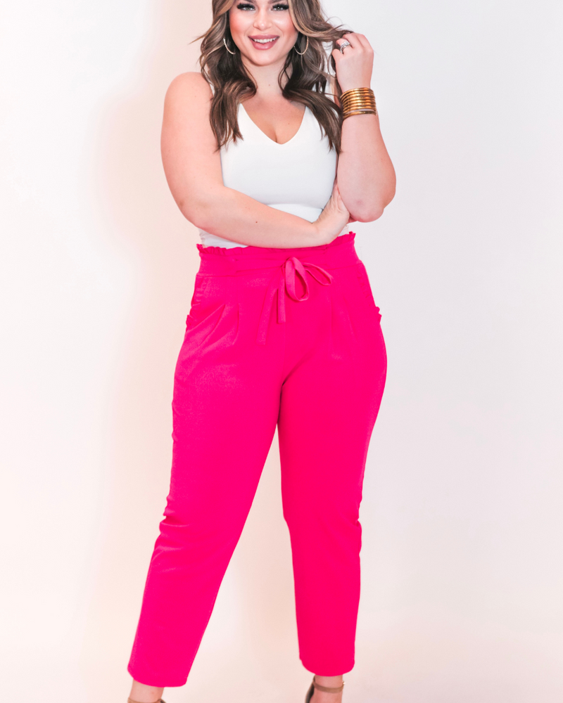 high-waisted paper-bag silhouette pants with a ruffle trim and sash tie, lightweight drapey fabric, straight legs, side pockets polished with a flirty ruffle, and unlined for breezy comfort in pink