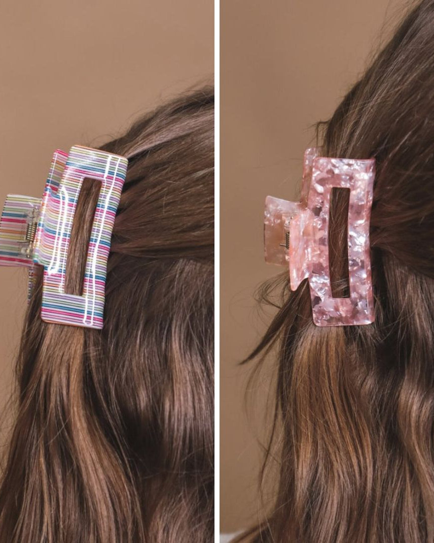 a small acrylic claw clip with a gentle grip that reduces breakage while providing a secure hold in multi and pink