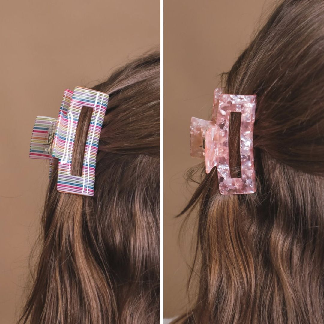 a small acrylic claw clip with a gentle grip that reduces breakage while providing a secure hold in multi and pink