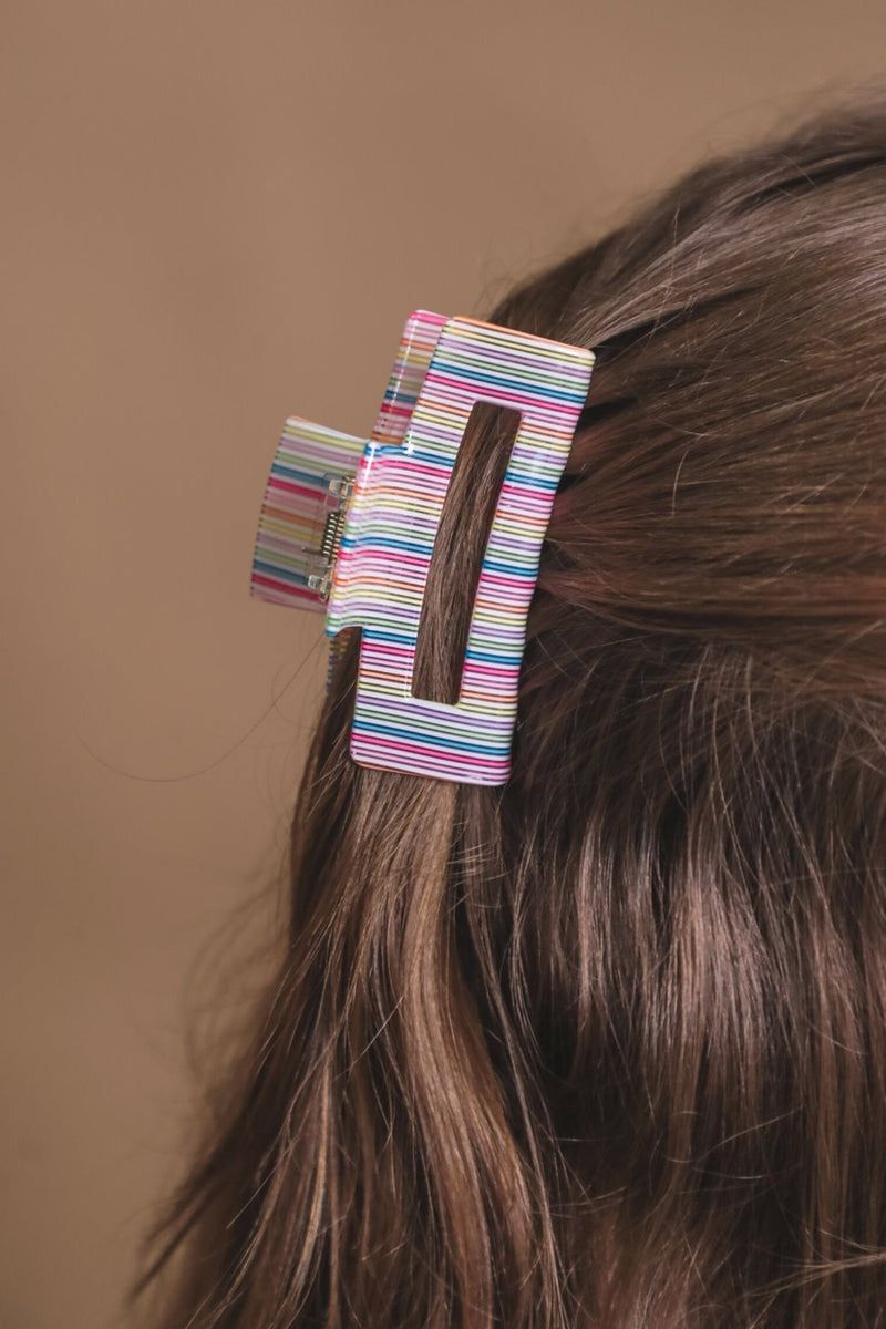 a small acrylic claw clip with a gentle grip that reduces breakage while providing a secure hold in multi