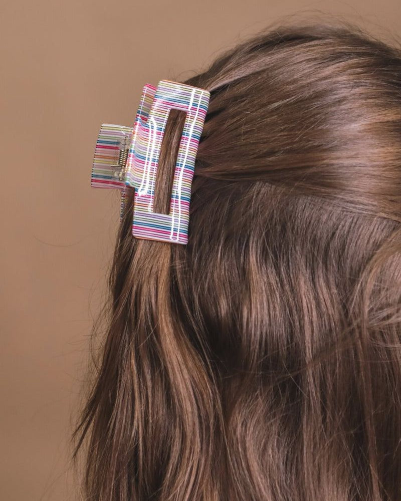 a small acrylic claw clip with a gentle grip that reduces breakage while providing a secure hold in multi