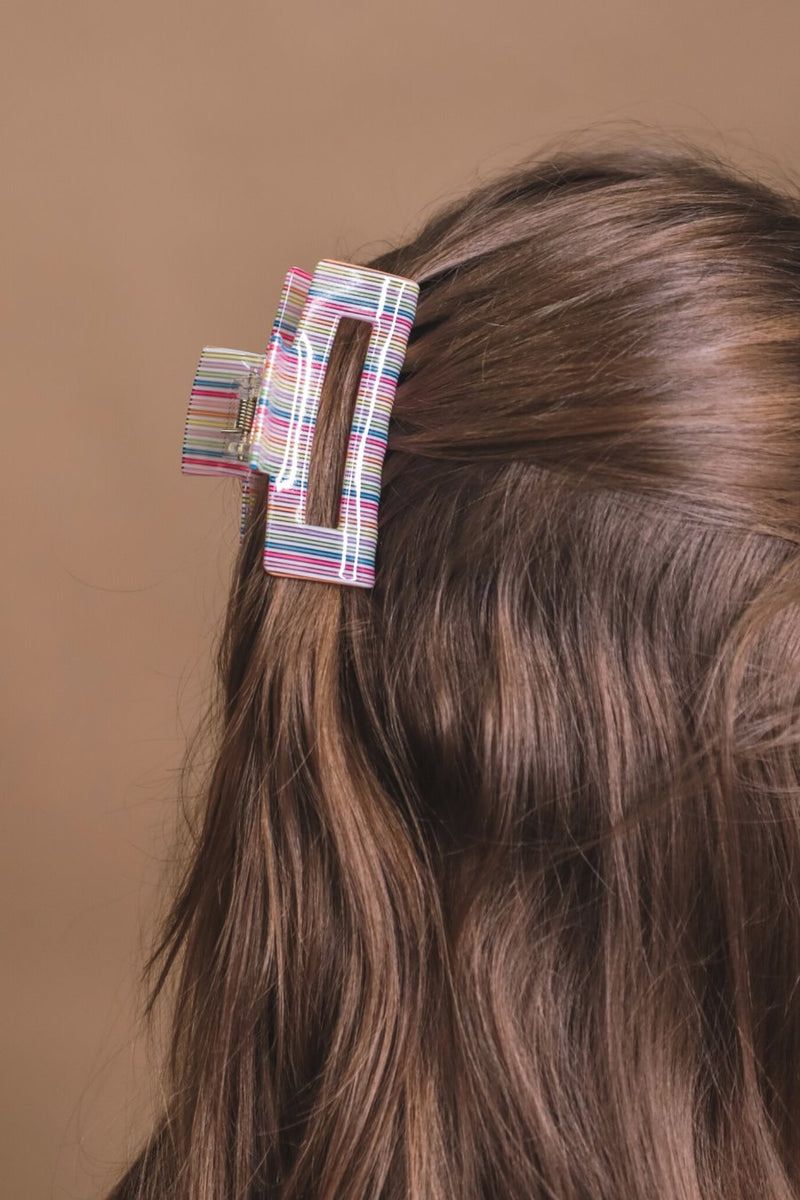 a small acrylic claw clip with a gentle grip that reduces breakage while providing a secure hold in multi