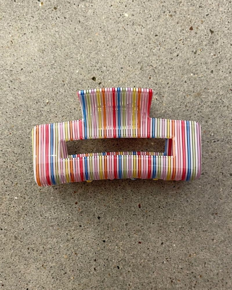 a small acrylic claw clip with a gentle grip that reduces breakage while providing a secure hold in multi