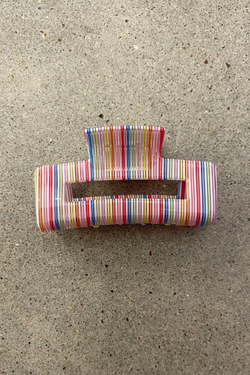 a small acrylic claw clip with a gentle grip that reduces breakage while providing a secure hold in multi