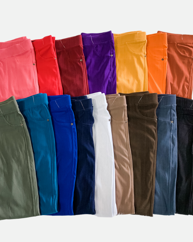 solid pull-on style leggings made of premium stretch fabric thicker than regular leggings, an elastic waistband, double back pockets, and a unique stripe detailing on the inside in coral, red, burgundy, purple, mustard, orange, rust, olive, teal, royal blue, navy, white, mocha, brown, charcoal, and black
