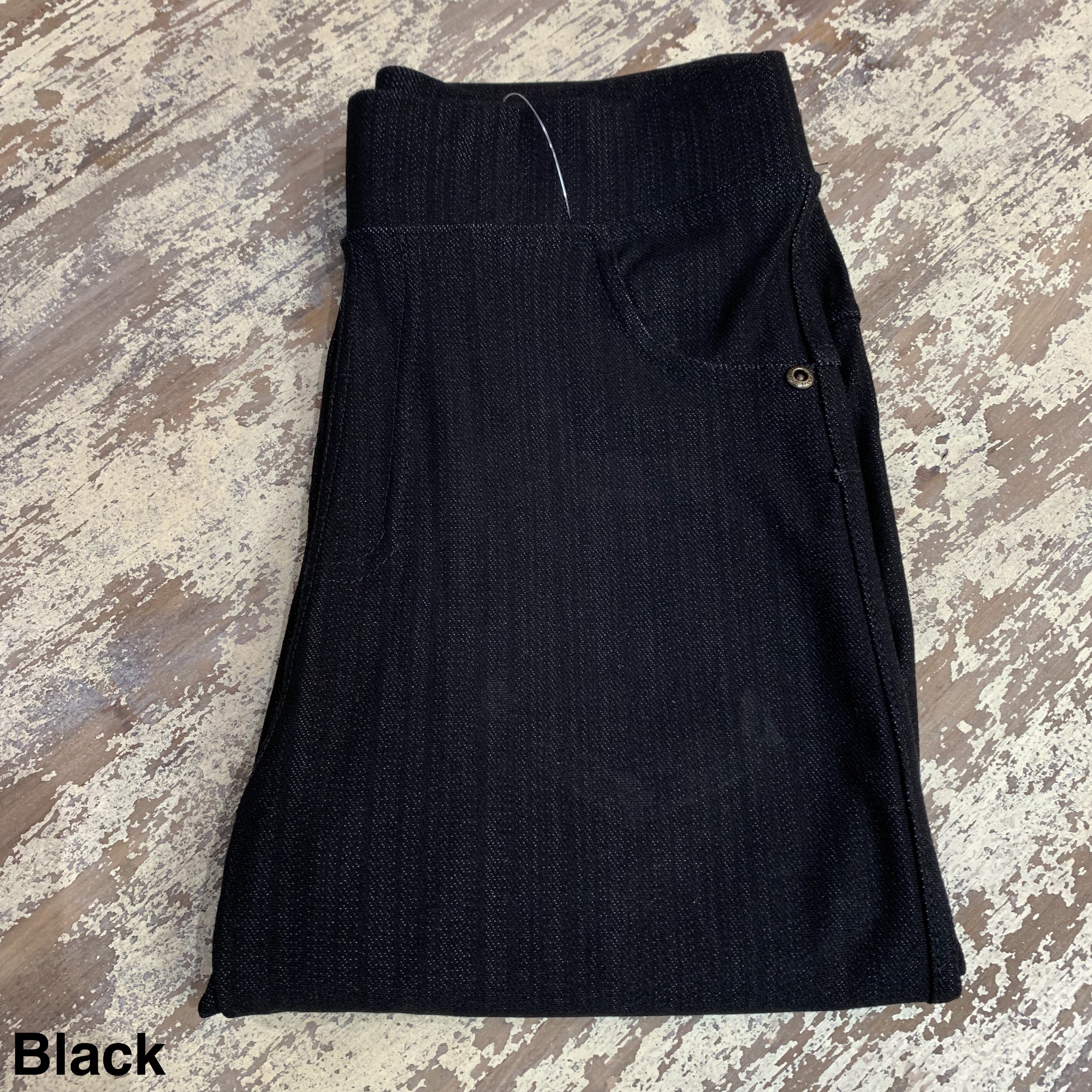 solid pull-on style leggings made of premium stretch fabric thicker than regular leggings, an elastic waistband, double back pockets, and a unique stripe detailing on the inside in black