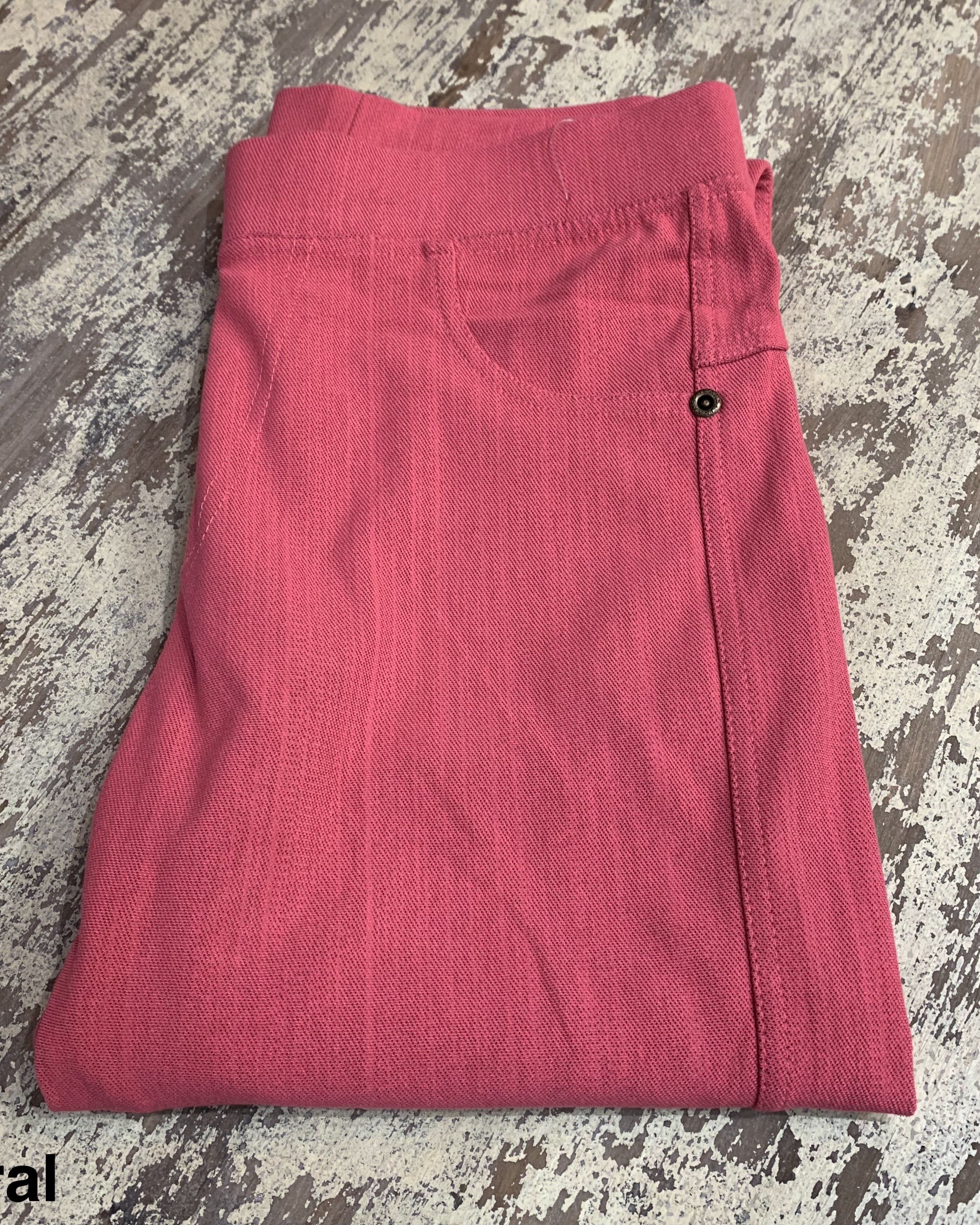 solid pull-on style leggings made of premium stretch fabric thicker than regular leggings, an elastic waistband, double back pockets, and a unique stripe detailing on the inside in coral