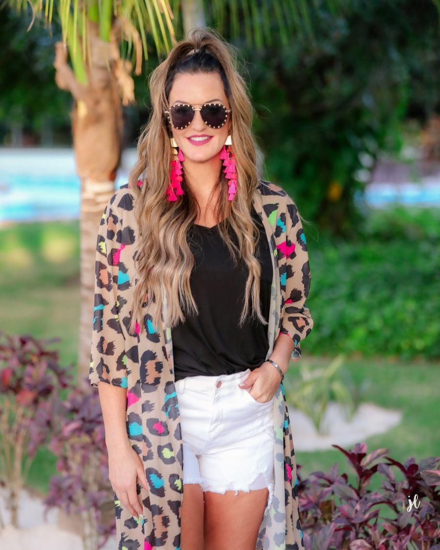 half-sleeve open front kimono made of lightweight material with a casual oversized, loose fit on a multi-colored leopard pattern prin