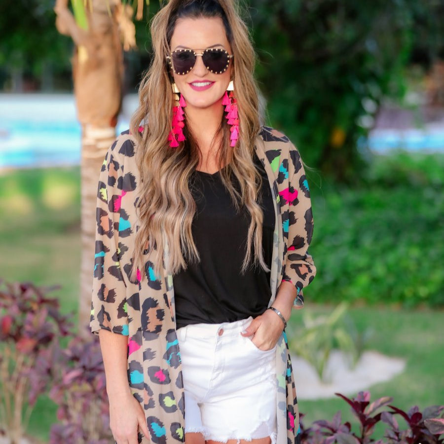 half-sleeve open front kimono made of lightweight material with a casual oversized, loose fit on a multi-colored leopard pattern prin