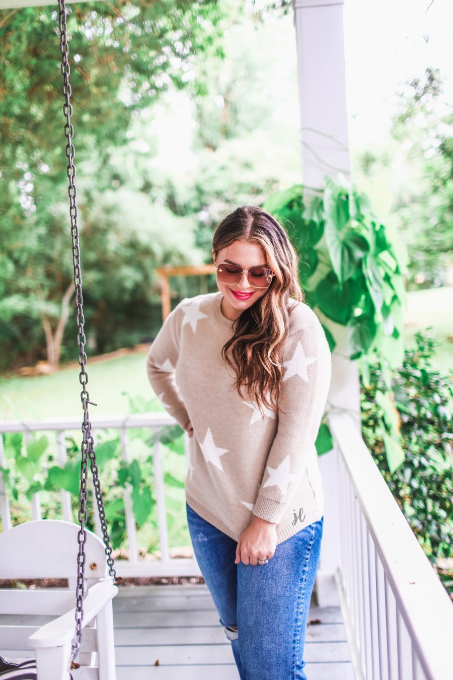 long-sleeve sweater crafted from soft knitted material with a crew neckline on a white star pattern print and a solid taupe base