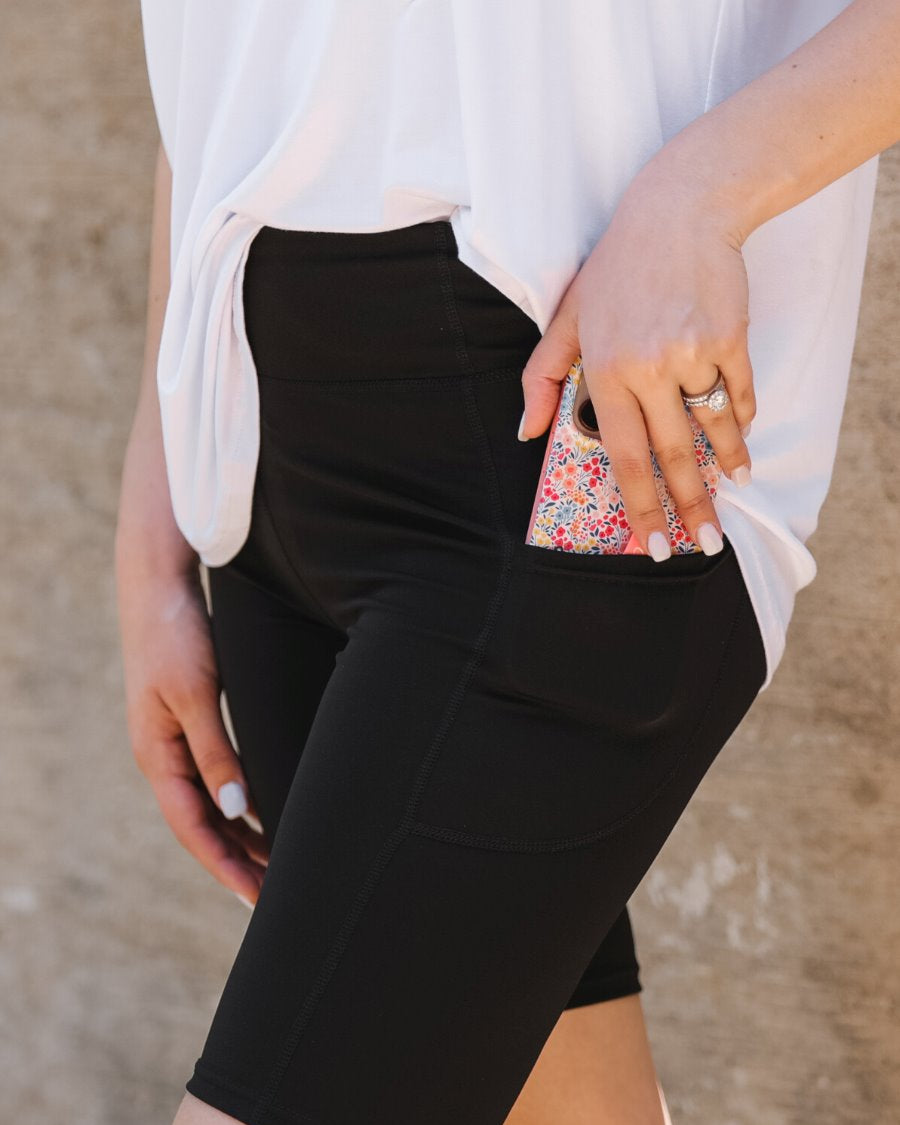 sleek black biker shorts crafted from lightweight stretch fabric with a high elastic waistband for tummy control, side pockets, a flattering figure-hugging short silhouette, above-knee length, and pull-on design Shorts BRITTANY