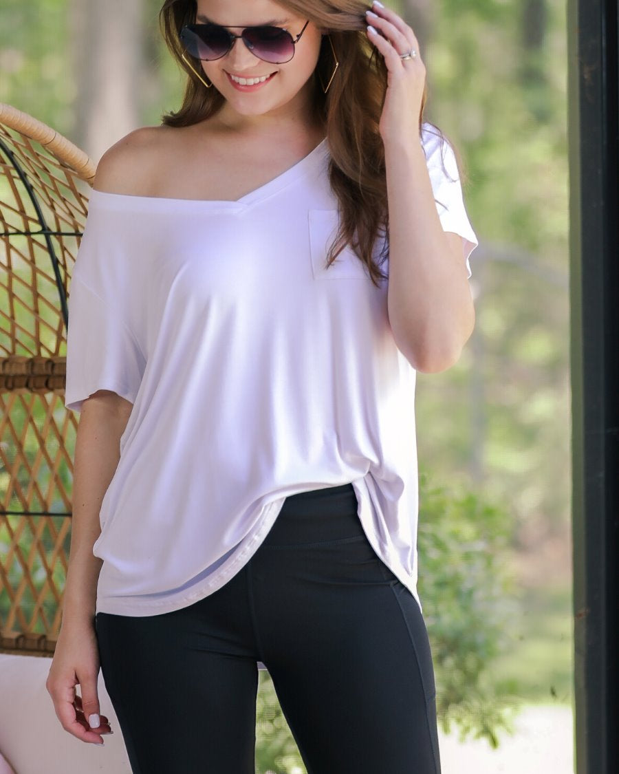 sleek black biker shorts crafted from lightweight stretch fabric with a high elastic waistband for tummy control, side pockets, a flattering figure-hugging short silhouette, above-knee length, and pull-on design