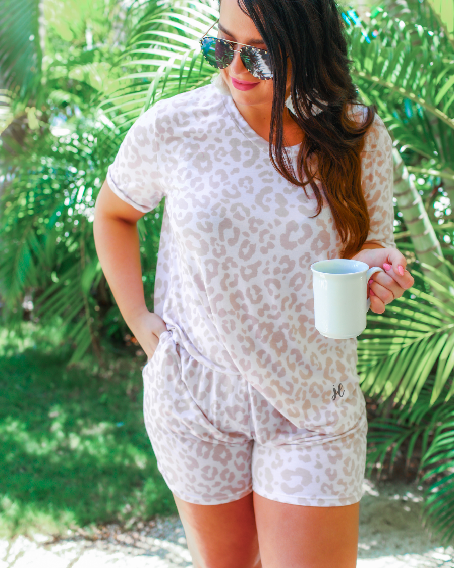 a neutral taupe animal print lounge set crafted from soft stretch fabric with a short-sleeve V-neck top, matching pull-on shorts, elastic waistband, side pockets, and relaxed fit