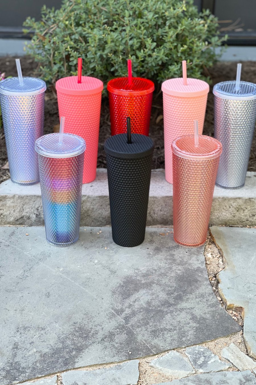 textured studded finish tumbler with matching reusable straw and screw on lid in black, hot pink, lavender, light pink, rainbow, red, and silver
