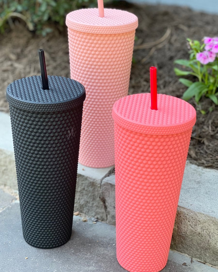 textured studded finish tumbler with matching reusable straw and screw on lid in black, hot pink, and light pink