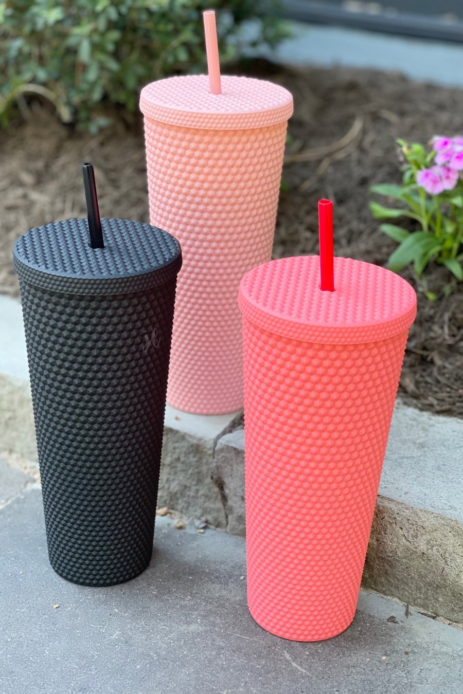 textured studded finish tumbler with matching reusable straw and screw on lid in black, hot pink, and light pink