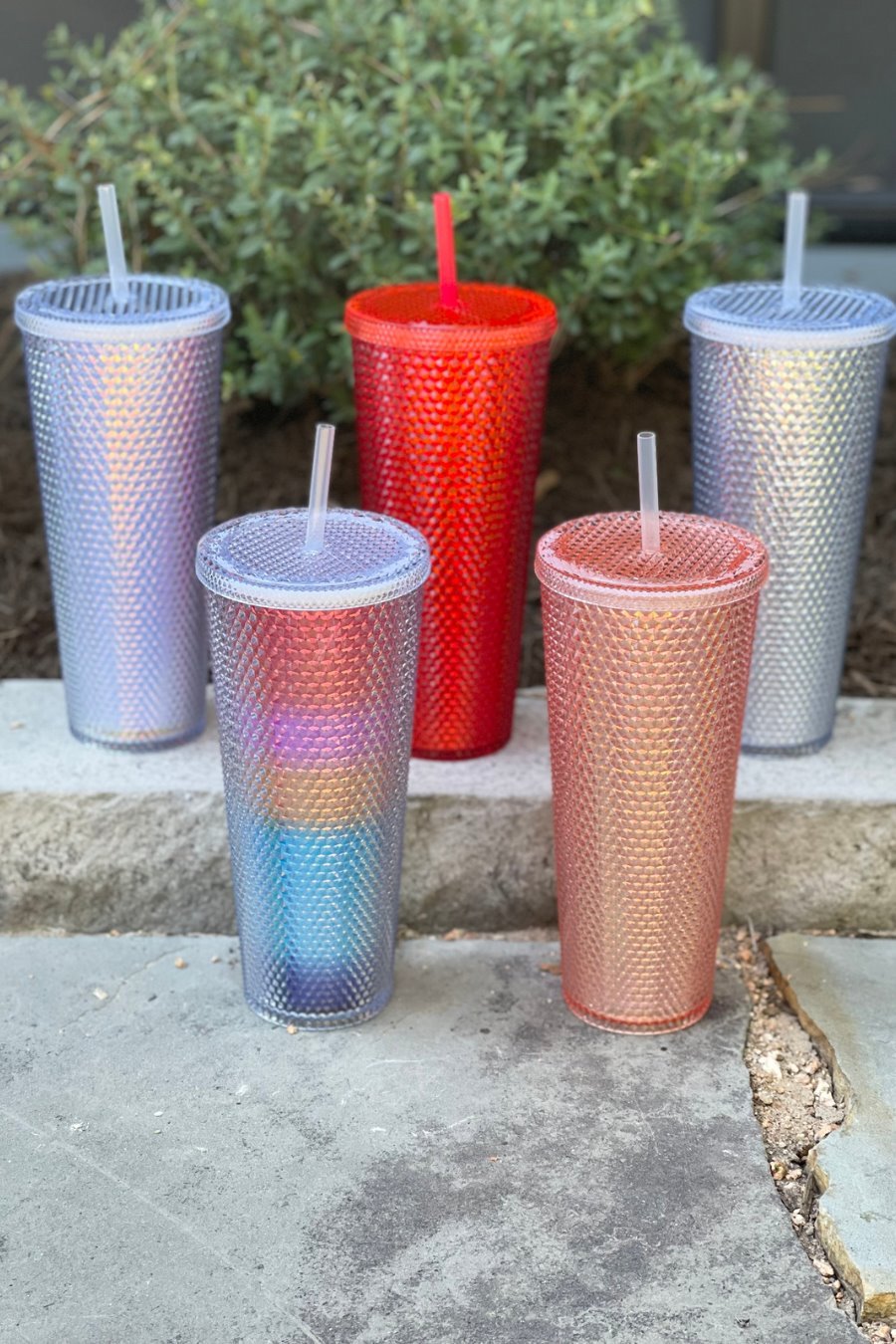 textured studded finish tumbler with matching reusable straw and screw on lid in lavender, rainbow, red, rose gold, and silver