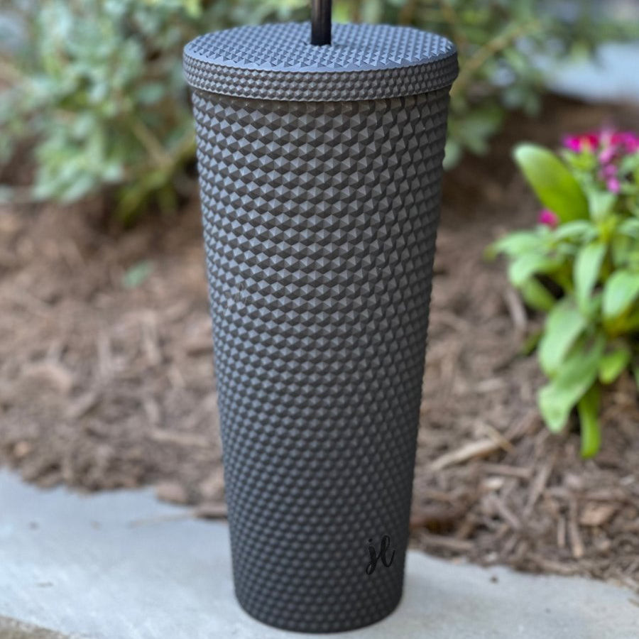 textured studded finish tumbler with matching reusable straw and screw on lid in black