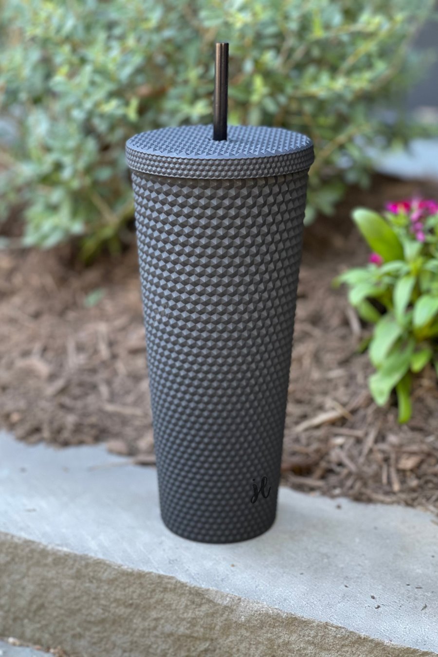 textured studded finish tumbler with matching reusable straw and screw on lid in black