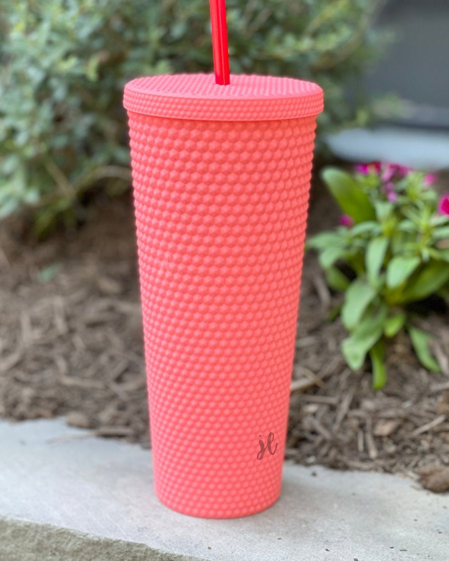 textured studded finish tumbler with matching reusable straw and screw on lid in hot pink
