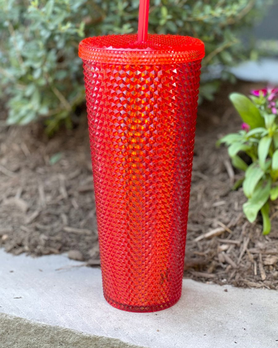 textured studded finish tumbler with matching reusable straw and screw on lid in red