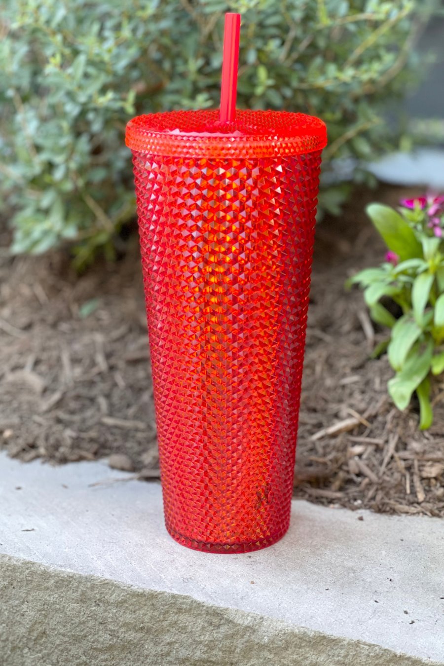 textured studded finish tumbler with matching reusable straw and screw on lid in red