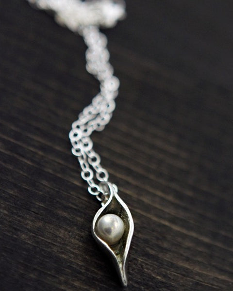 one pea in a pod made of fine pewter with freshwater pearls on an 18" plated link chain necklace available in one pod