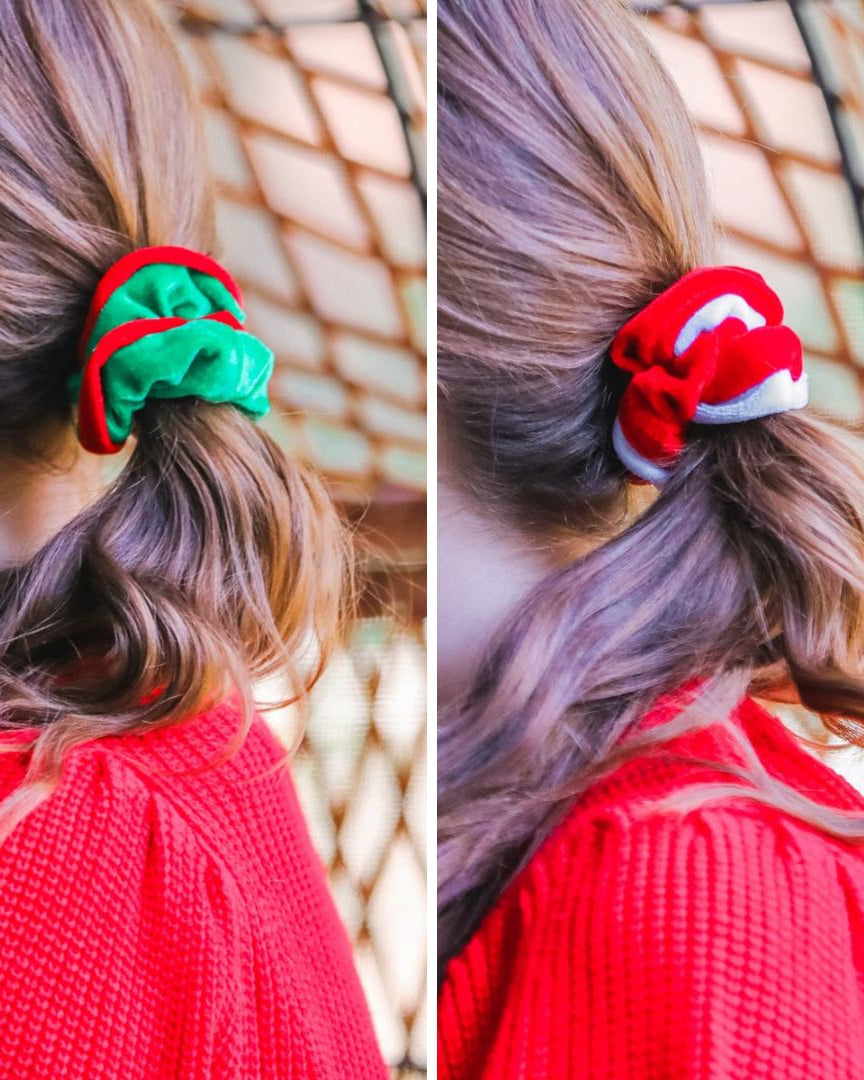 a plush velvet scrunchie in a rich nostalgic colorway (classic green with red trim or bold red with white trim) with contrasting trim and comfortable elastic