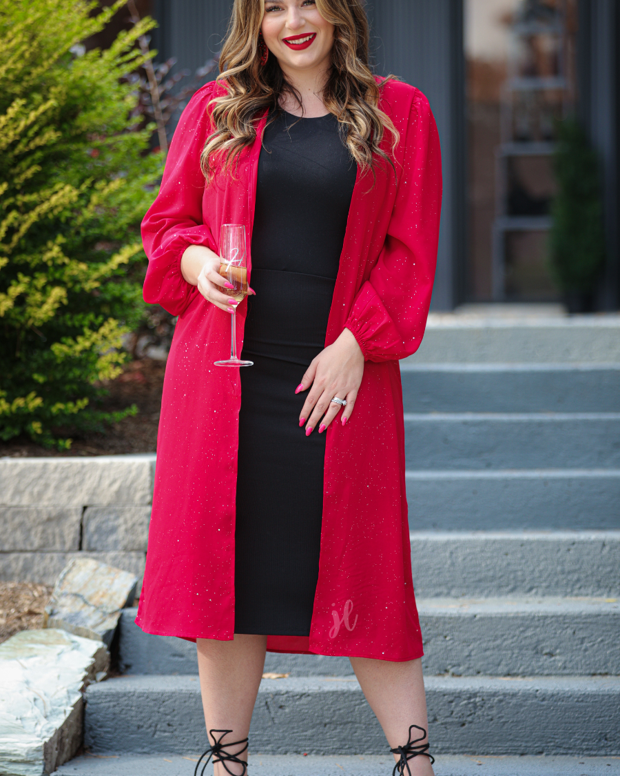 a lightweight shimmery fabric kimono with an open front, straight hemline, and dramatic balloon sleeves finished with softly gathered elastic cuffs for an effortlessly polished look