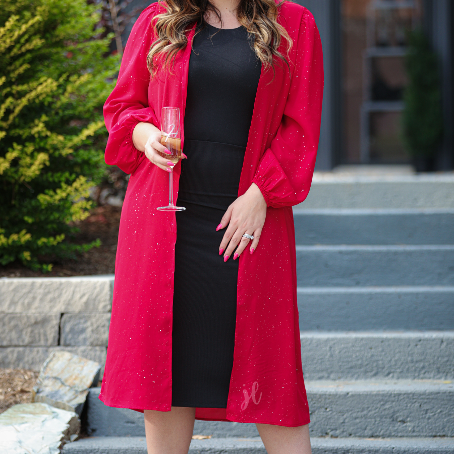 a lightweight shimmery fabric kimono with an open front, straight hemline, and dramatic balloon sleeves finished with softly gathered elastic cuffs for an effortlessly polished look