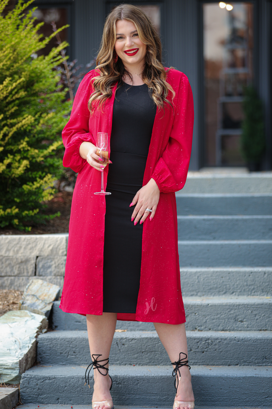 a lightweight shimmery fabric kimono with an open front, straight hemline, and dramatic balloon sleeves finished with softly gathered elastic cuffs for an effortlessly polished look