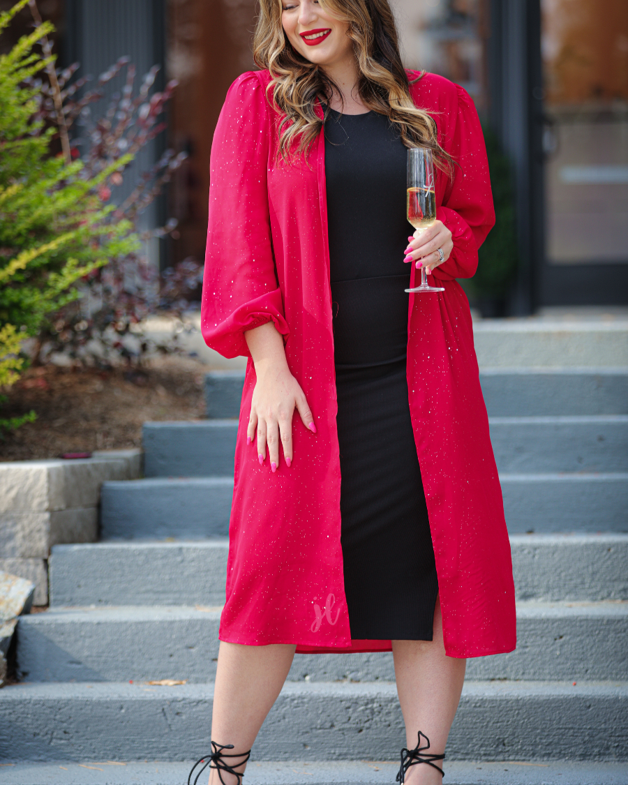 a lightweight shimmery fabric kimono with an open front, straight hemline, and dramatic balloon sleeves finished with softly gathered elastic cuffs for an effortlessly polished look