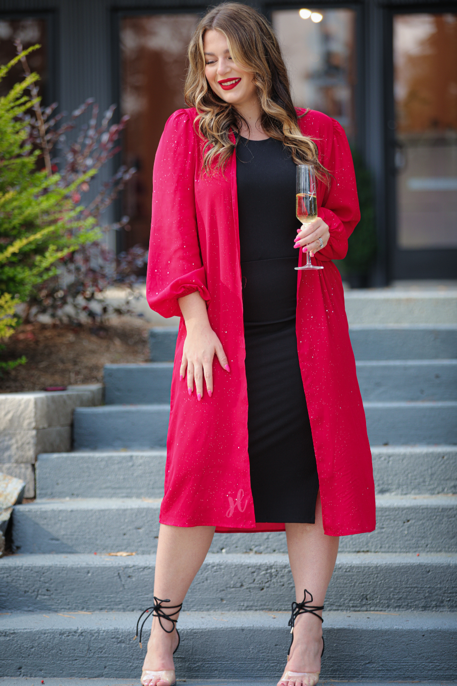 a lightweight shimmery fabric kimono with an open front, straight hemline, and dramatic balloon sleeves finished with softly gathered elastic cuffs for an effortlessly polished look