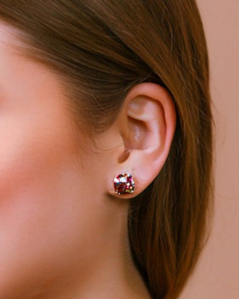 a dainty gold-plated stud earring with glitter sparkles, a comfort replacement earring back with a plastic disk stopper style in multicolor