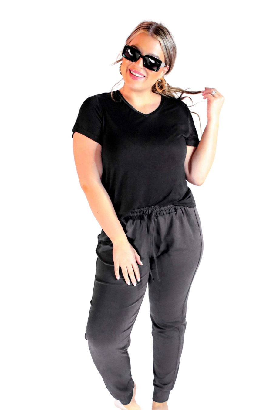 mid-rise joggers with a relaxed fit, an adjustable drawstring waist, and black banded ankles, accented with black trim on our best-selling sublimation printed everyday fabric base in a sleek solid black