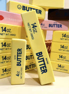 Multiple boxes of 'BUTTER' squishies brand product with visible branding