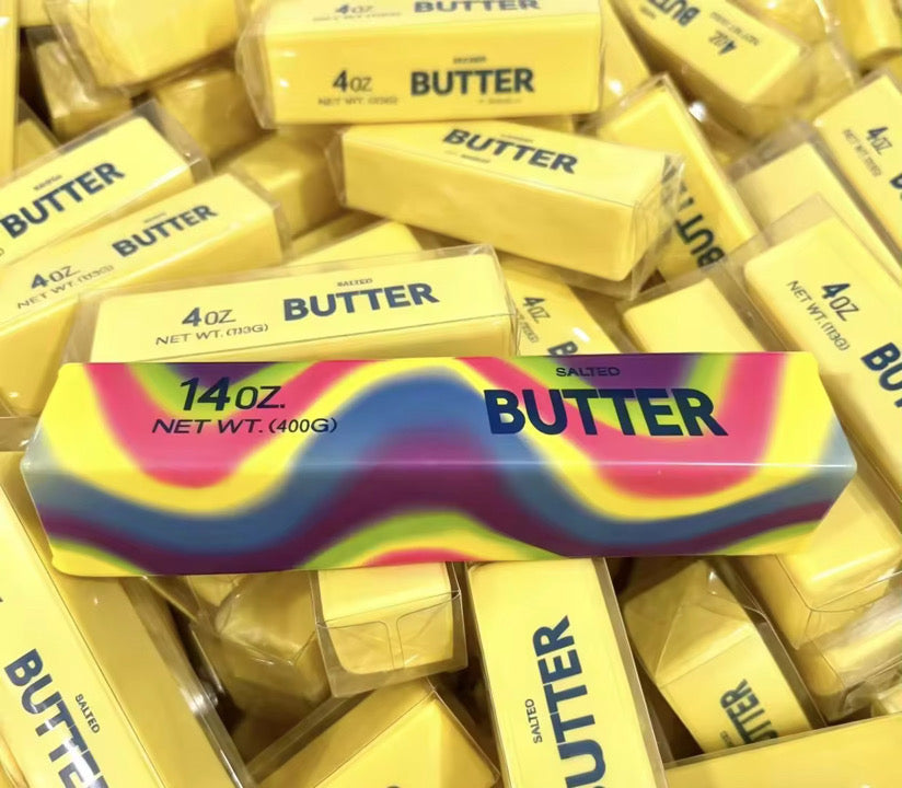 giant 14oz slow-rising salted butter-stick squishies with realistic labeling, and an oversized shape in rainbow and yellow