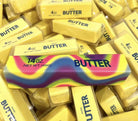 giant 14oz slow-rising salted butter-stick squishies with realistic labeling, and an oversized shape in rainbow and yellow