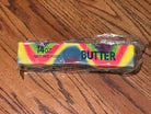 a giant 14oz rainbow slow-rising salted butter-stick squishy with realistic labeling, and an oversized shape