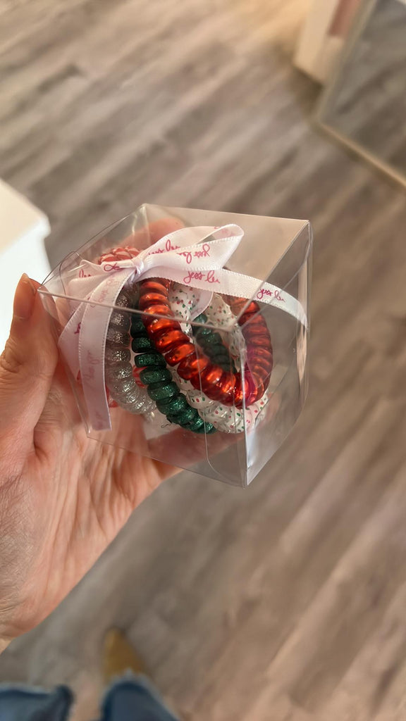 5-piece hair tie set made with durable plastic in festive seasonal colors packaged in a clear gift box