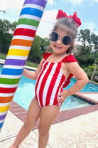 red and white vertical stripe one-piece swimsuit with ruffle sleeves and a criss-cross back