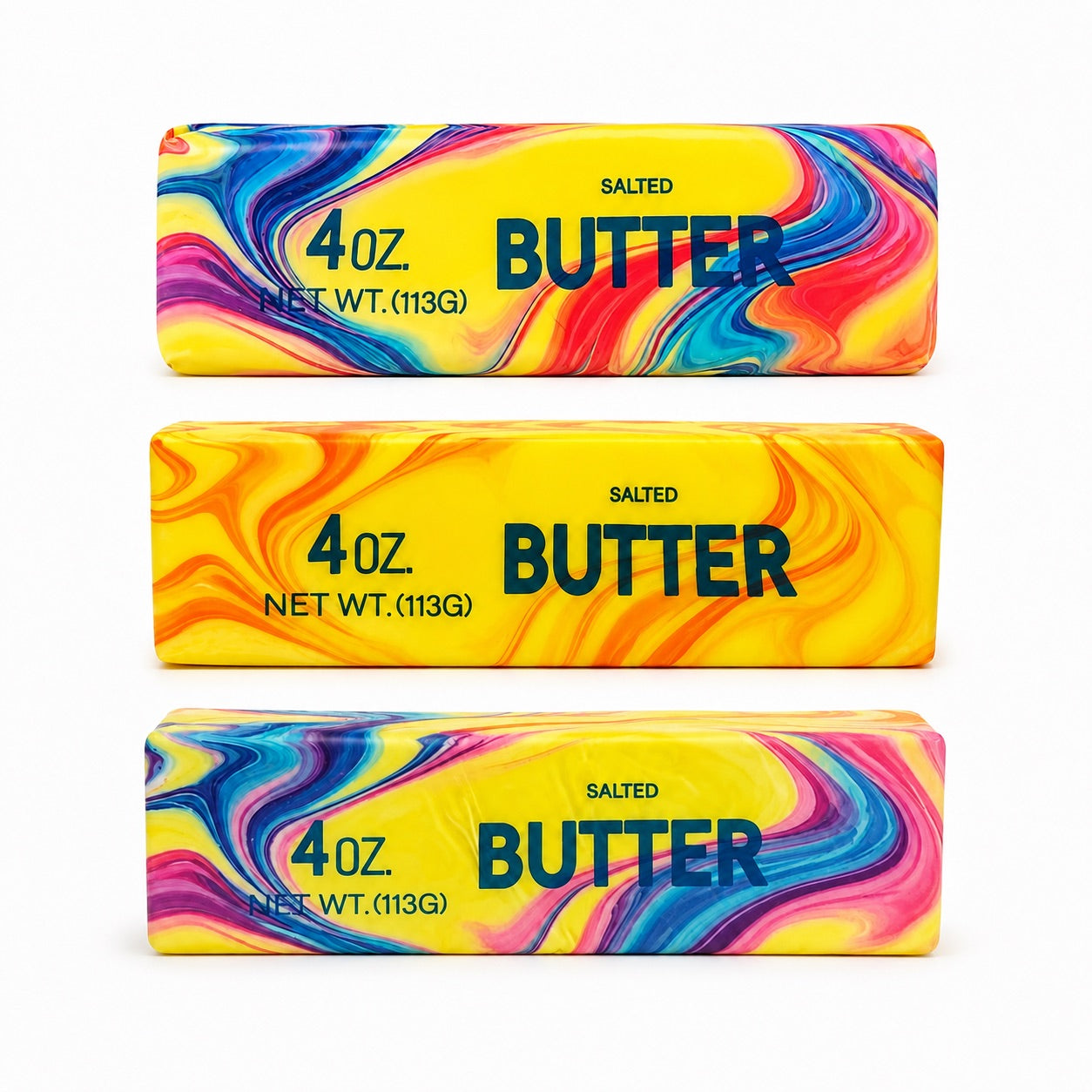 a 4oz butter-stick inspired squishy with a marbled design, salted butter label, soft squeezable texture, and clear individual packaging in colors from top to bottom rainbow swirl (red), citrus swirl (orange), and cotton candy swirl (pink)