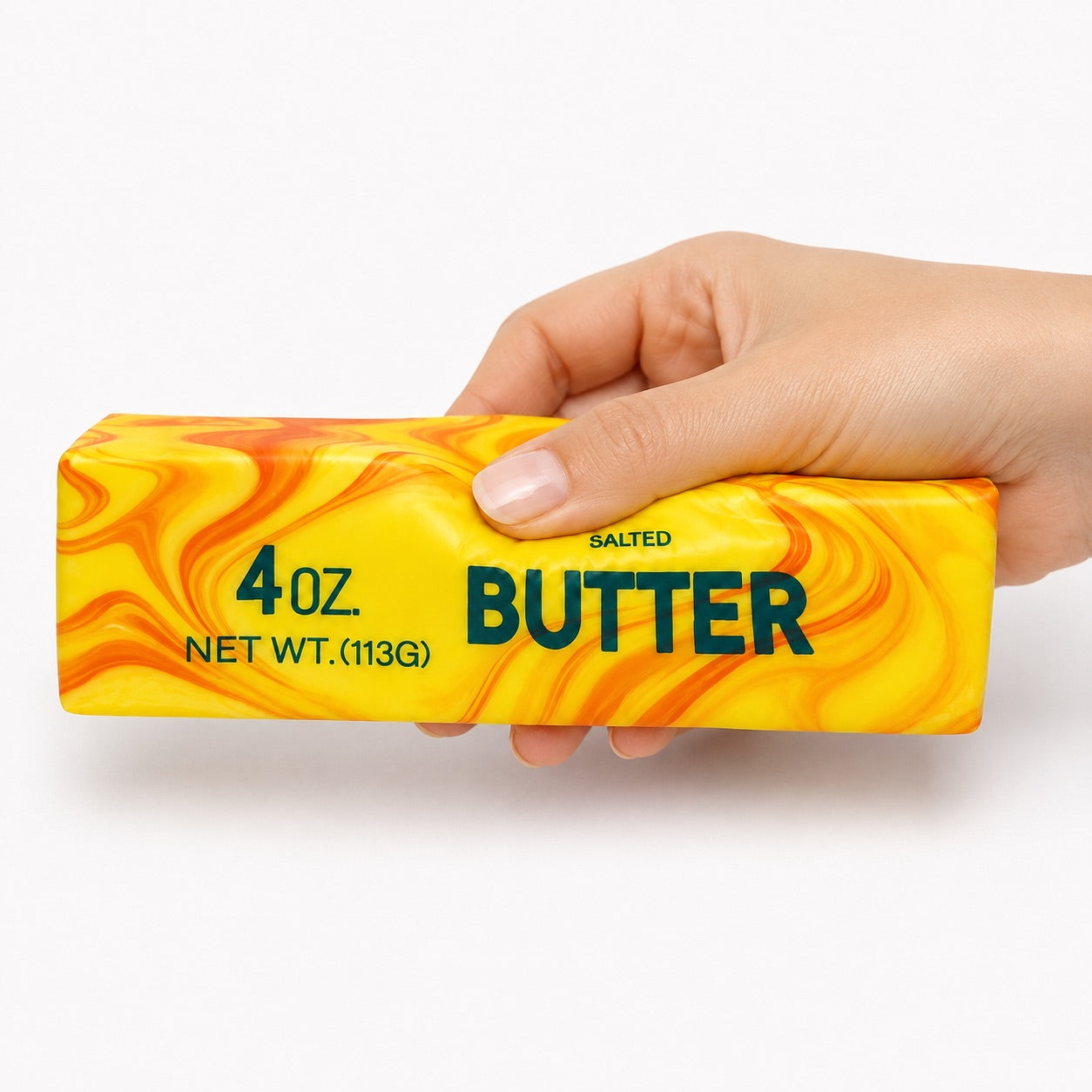 a 4oz butter-stick inspired squishy with a marbled design, salted butter label, soft squeezable texture, and clear individual packaging in citrus swirl (orange)