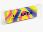 Colorful block of salted butter in a clear package on a white background