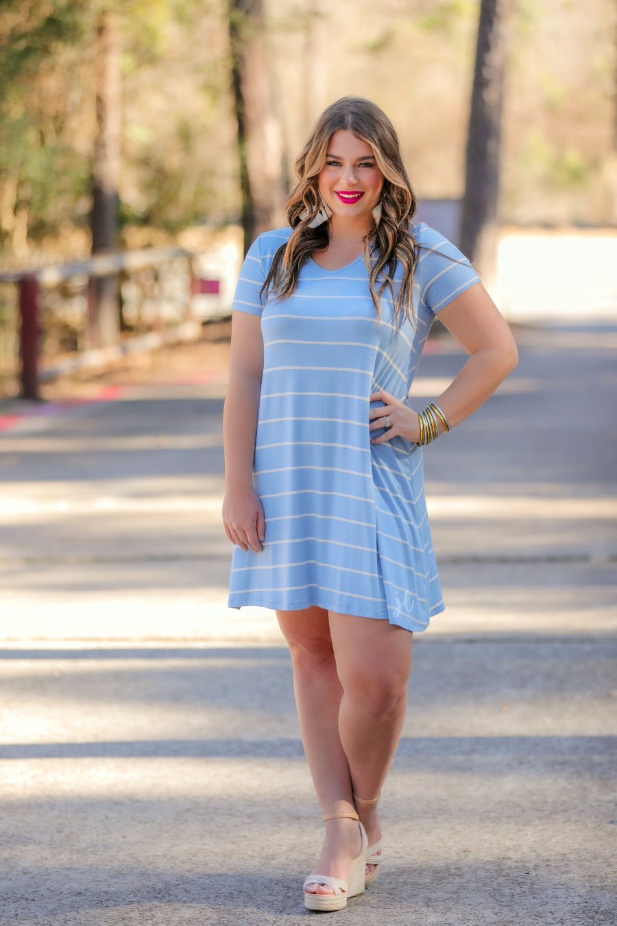 short-sleeve A-line dress with a V-neckline, crafted from ultra-soft fabric in a solid color with horizontal white stripes and a straight hemline in chambray