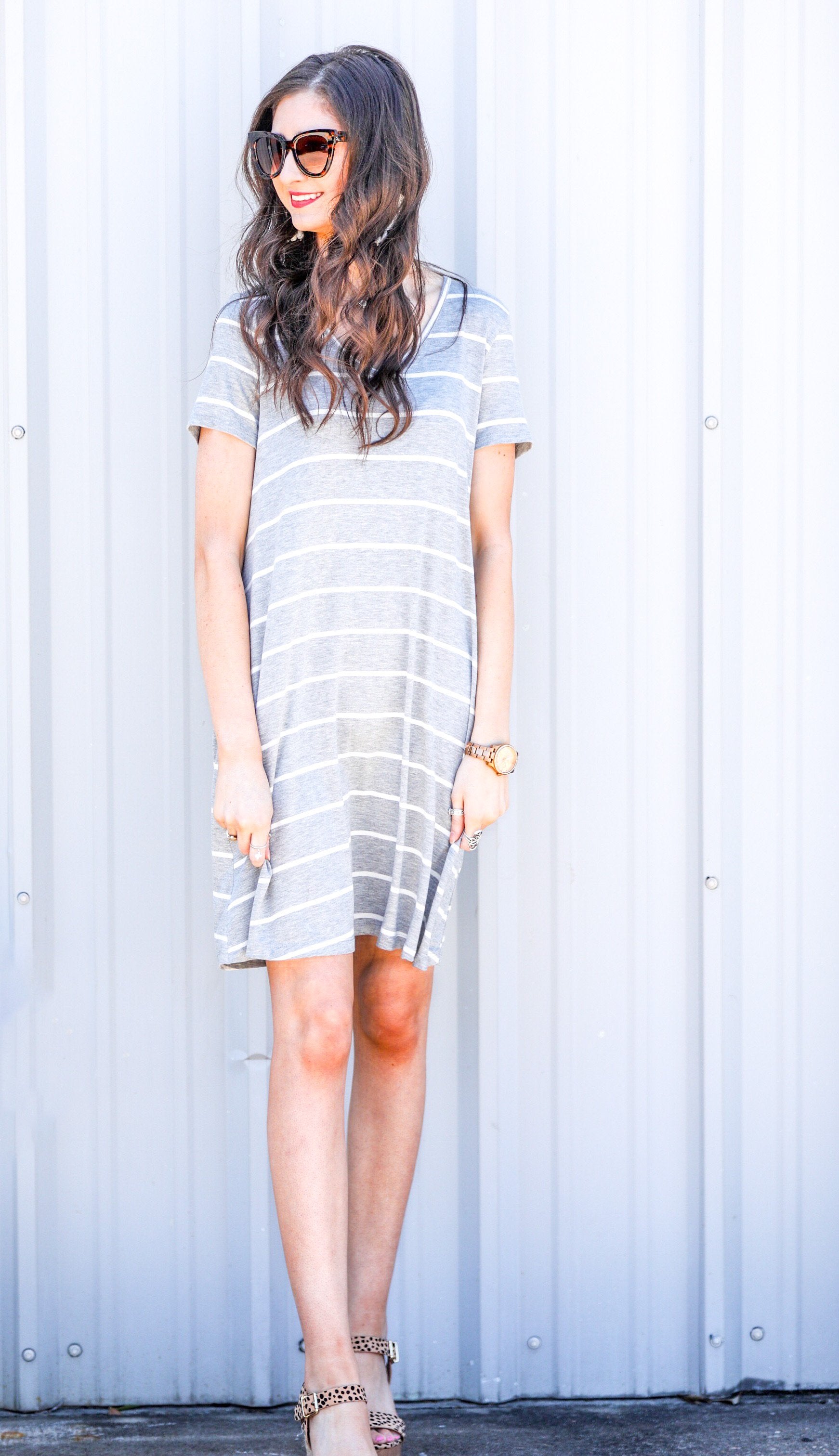 short-sleeve A-line dress with a V-neckline, crafted from ultra-soft fabric in a solid color with horizontal white stripes and a straight hemline in heathered grey