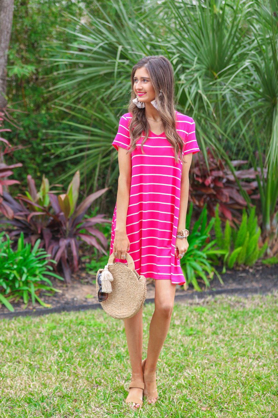 short-sleeve A-line dress with a V-neckline, crafted from ultra-soft fabric in a solid color with horizontal white stripes and a straight hemline in hot pink