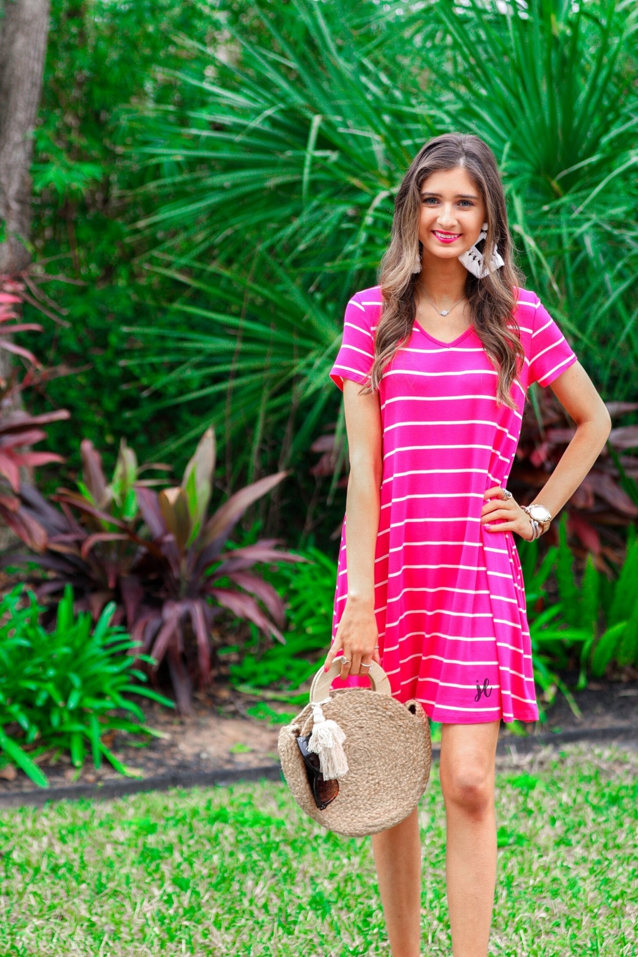 short-sleeve A-line dress with a V-neckline, crafted from ultra-soft fabric in a solid color with horizontal white stripes and a straight hemline in hot pink